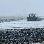 Fields get worked north of Morden Nov. 6 as the flurries flew.
