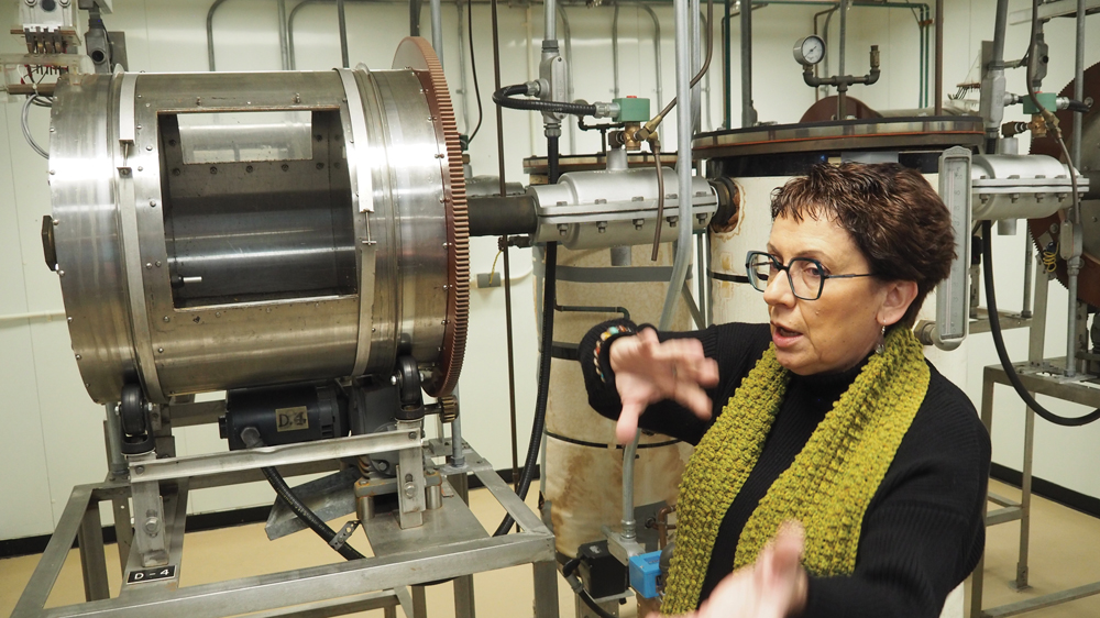Marta Izydorczyk, research scientist and program manager with the Canadian Grain Commission, explains the function of a germination drum during the laboratory tour.