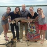 The Sopuck family with a 125-centimetre sturgeon caught off the family dock on the Winnipeg River.