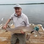 Tim Sopuck with a 130-centimetre sturgeon.