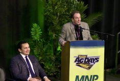 Manitoba Premier Wab Kinew (seated) and Manitoba agriculture minister Ron Kostyshyn during the Jan. 16, 2024, announcement at Manitoba Ag Days.