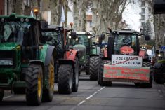Farmers protesting in Toulouse, France, on January 16, 2024, with tractors bearing placards that read &#8216;Macron still an effort, soon all farmers will be dead&#8217;. Photo by Alain Pitton/NurPhoto via Reuters

