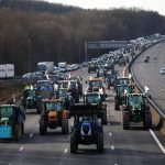 French farmers drive their tractors on a highway as they protest over price pressures, taxes and green regulation, grievances shared by farmers across Europe, in Longvilliers, near Paris, France, January 29, 2024. REUTERS/Sarah Meyssonnier
