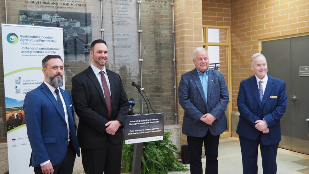 (L-R) Greg Cherewyk, Pulse Canada president; Ben Carr, Winnipeg South-Centre MP; Pulse Canada board member John Preune and James House, Manitoba Strategic Research Chair in Sustainable Protein at the University of Manitoba, gather at the university Feb. 9 to announce federal funding for the pulse sector.
