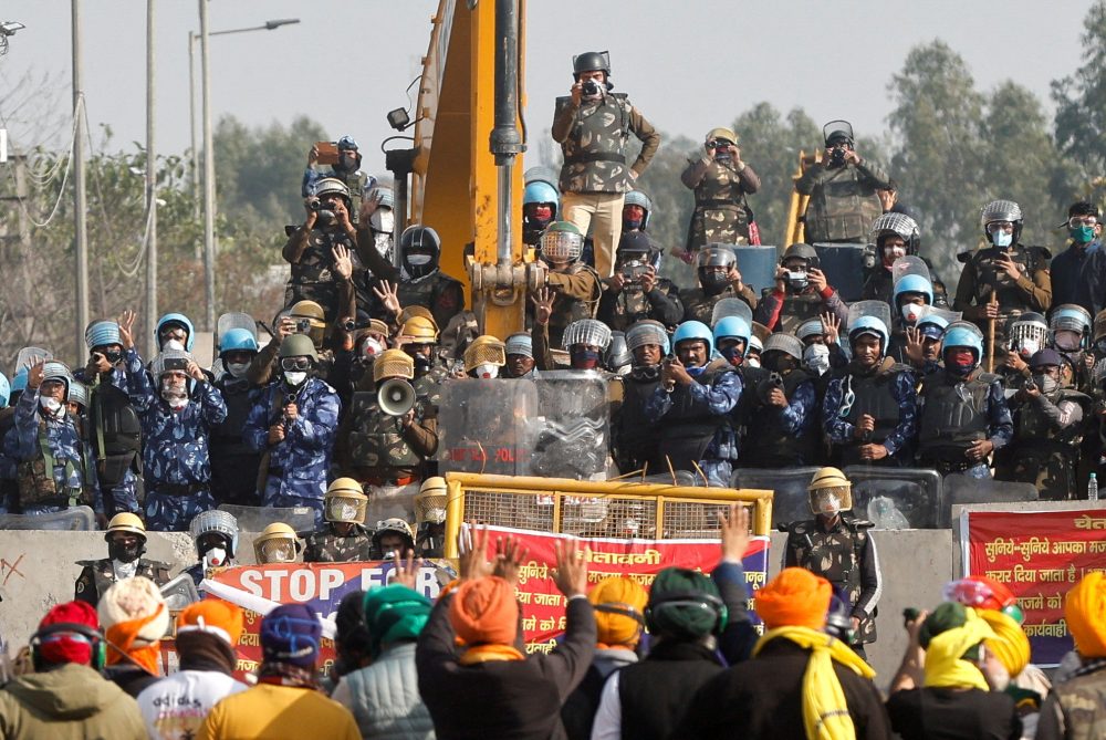 FILE PHOTO: Farmers gesture towards police officers at the site of a protest as they march towards New Delhi to press for better crop prices, at Shambhu barrier, a border crossing between Punjab and Haryana states, India, February 21, 2024. REUTERS/Francis Mascarenhas/File Photo
