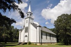 St. Lupicin Roman Catholic Church features well-treed grounds.