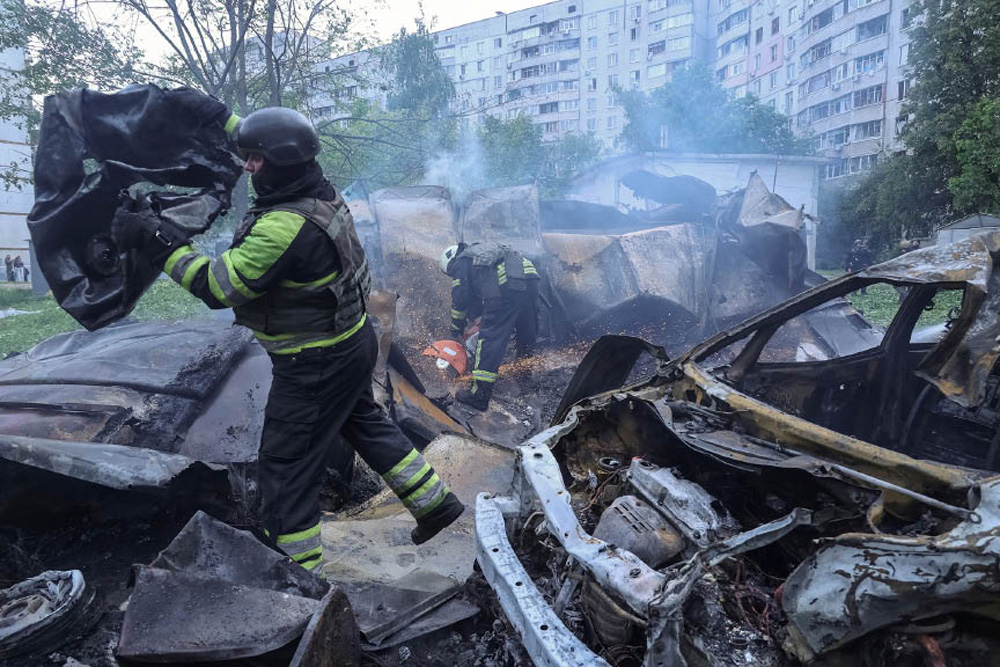 Firefighters work at the site of a Russian air strike, amid Russia’s attack on Ukraine, in Kharkiv, Ukraine May 14, 2024.