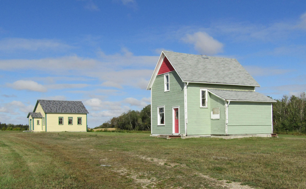 The Olha School and McNarry house at the Prairie Mountain Museum.