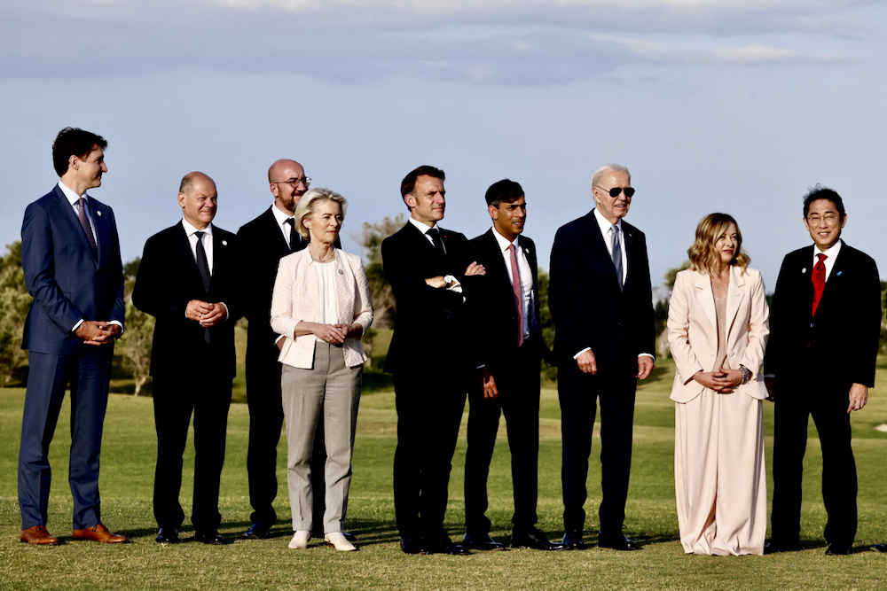 U.S. President Joe Biden, Canada’s Prime Minister Justin Trudeau, France’s President Emmanuel Macron, Japan’s Prime Minister Fumio Kishida, Italy’s Prime Minister Giorgia Meloni, German Chancellor Olaf Scholz, Britain’s Prime Minister Rishi Sunak, European Council President Charles Michel and European Commission President Ursula von der Leyen stand together on the first day of the G7 summit, in Savelletri, Italy, June 13, 2024. Photo: Reuters/Yara Nardi/File Photo
