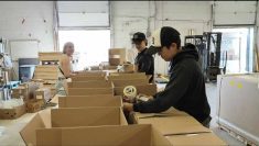 Workers at Arctic Buying Company Kivalliq Inc. pack hampers that will be shipped up to Canada's north.