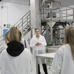 Delta 9 CEO John Arbuthnot shows a tour group Delta 9’s automated packaging line in early 2020. Photo: Geralyn Wichers