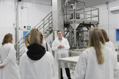 Delta 9 CEO John Arbuthnot shows a tour group Delta 9’s automated packaging line in early 2020. Photo: Geralyn Wichers