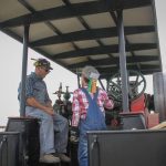 Andy MacMillan and Max Farquhar aboard a steam engine at the Manitoba Agricultural Museum on July 25.