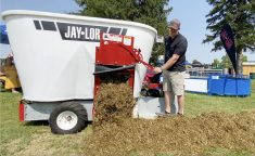 Jerry Oude Egberink, Ontario and Manitoba territory manager, releases a sheep TMR ration from the Jaylor mixer during a demonstration at Canada&#8217;s Outdoor Farm Show, Sept. 11, 2024.
