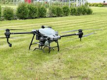 A spray drone used water to demonstrate the potential of the technology at the 2024 Prairie Fruit Growers Association’s annual farm tour June 5. 