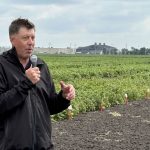 Jamie Larsen, research scientist from AAFC Harrow in Ontario speaking at MSPG's Dry Bean field tour in Morden, Mantioa in August.