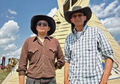 Kobe Wolf Child, left, and Warren Many Grey Horses, who work in agriculture on southern Alberta’s Blood Indian Reservation.