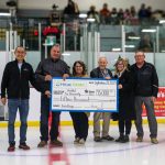 Karan Sangfai (left), Hylife president and chief executive officer presents $15,000 to Habitat for Humanity representatives for their Neepawa chapter.