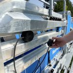 The "magic eye" sensors magnetically affix on the Racewell HD4 chute allowing for easy adjustment to match the livestock's size during Canada's Outdoor Farm Show in Woodstock, Sept. 11, 2024.