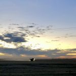 A combine in the Interlake runs against the setting sun on Nov. 1, 2022, in an effort to wrap up harvest.  Photo: Greg Berg