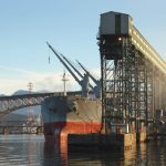 A freighter is loaded with grain from a terminal at Vancouver’s Burrard Inlet. (Maxvis/iStock/Getty Images)
