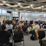 A group of community members attend a presentation by the Climate Action Team, a policy group in Manitoba, about strengthening public transportation options in the province at Brandon University on Oct. 18. 