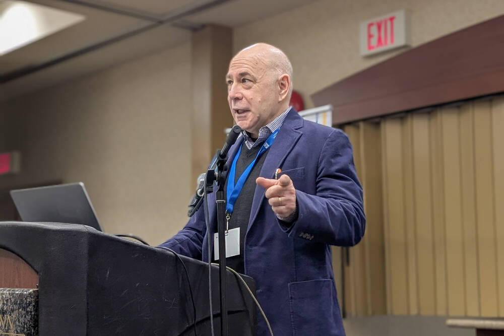 Janos Botschner, a researcher with Community Safety Knowledge Alliance, talks digital defences for farms at Crop Connect in Winnipeg Feb. 12, 2025. 