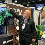 Trevor Thiessen of Redekop Manufacturing explains the company’s straw chopper to a farmer from Oregon at the Commodity Classic in Denver, Colorado, March 4. Redekop and other Canadian manufacturers are adjusting to 25 per cent tariffs on goods exported to the United States. | Robert Arnason photo

