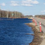 Flooding encroaches on Highway 2 near Rathwell, Man., in 2022. 