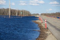 Flooding encroaches on Highway 2 near Rathwell, Man., in 2022.