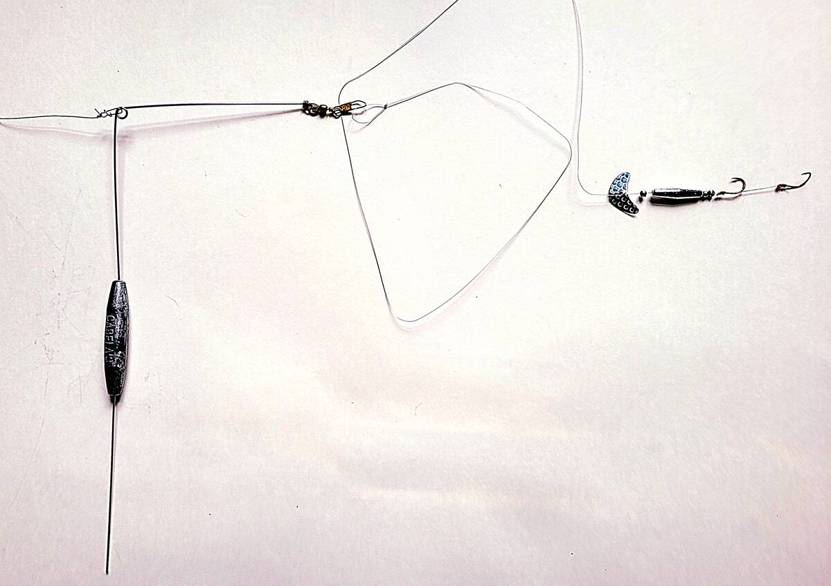 A basic bottom bouncer set up: line from the rod connects on the left and a two-hook spinner rig is connected to the trailing wire at the right. Photo: Tim Sopuck