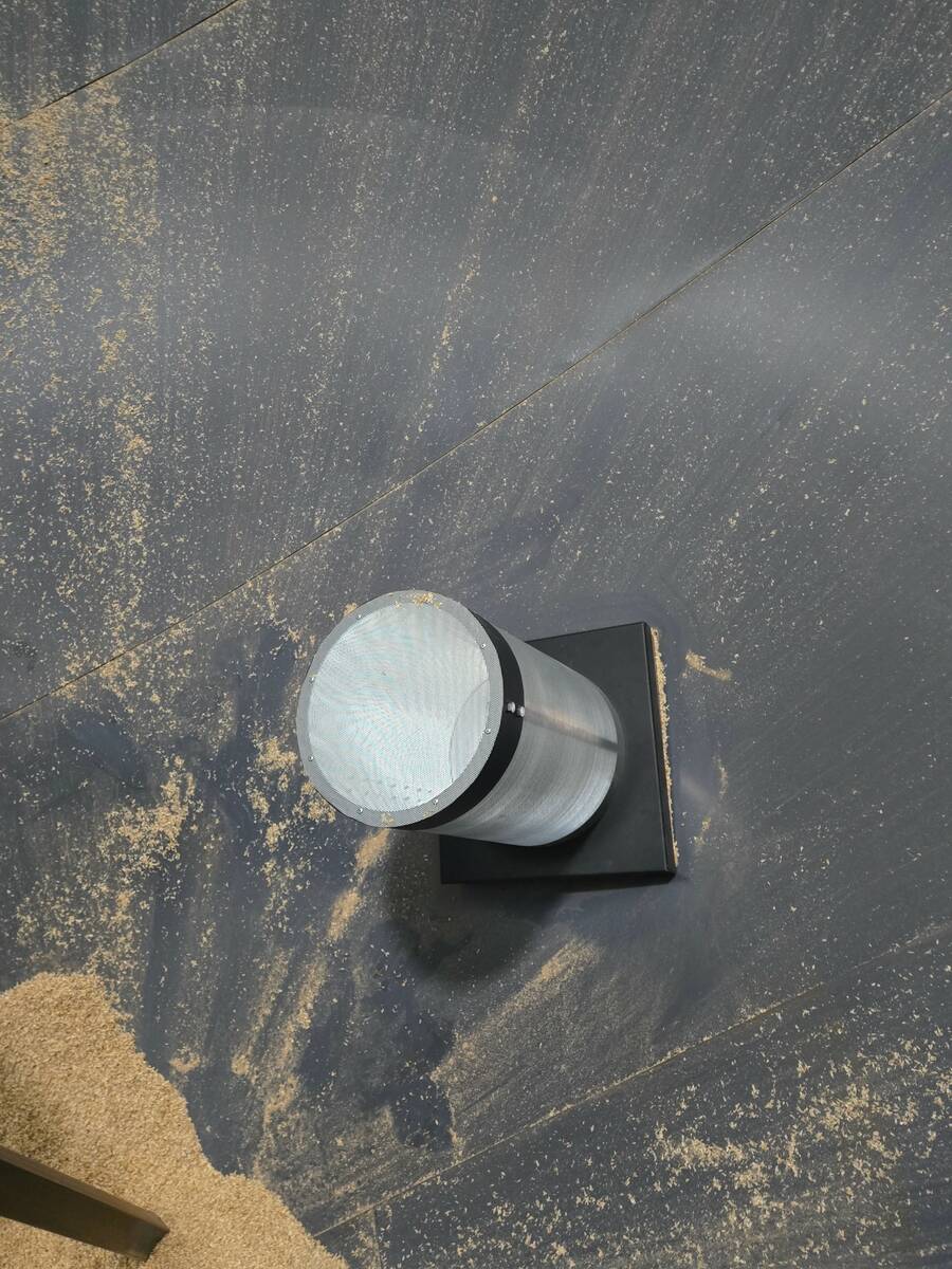 Wavcor’s Manhole system uses a perforated cylinder that can be installed in a hopper-bottom bin’s manhole. Photo: Wavcor