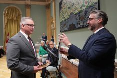 Heath MacDonald, left, is sworn in as federal agriculture minister at Rideau Hall in Ottawa May 13. Photo: Reuters