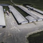 A hog barn is pictured from an aerial view.