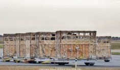 Horse shipping crates can be seen waiting to be loaded at Richardson International Airport.