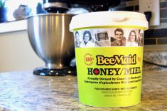A container of honey proudly displays its Canadian farm origins. 