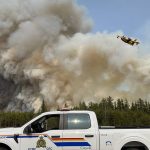 Smoke rises off a raging wildfire in northern Manitoba May 30.
