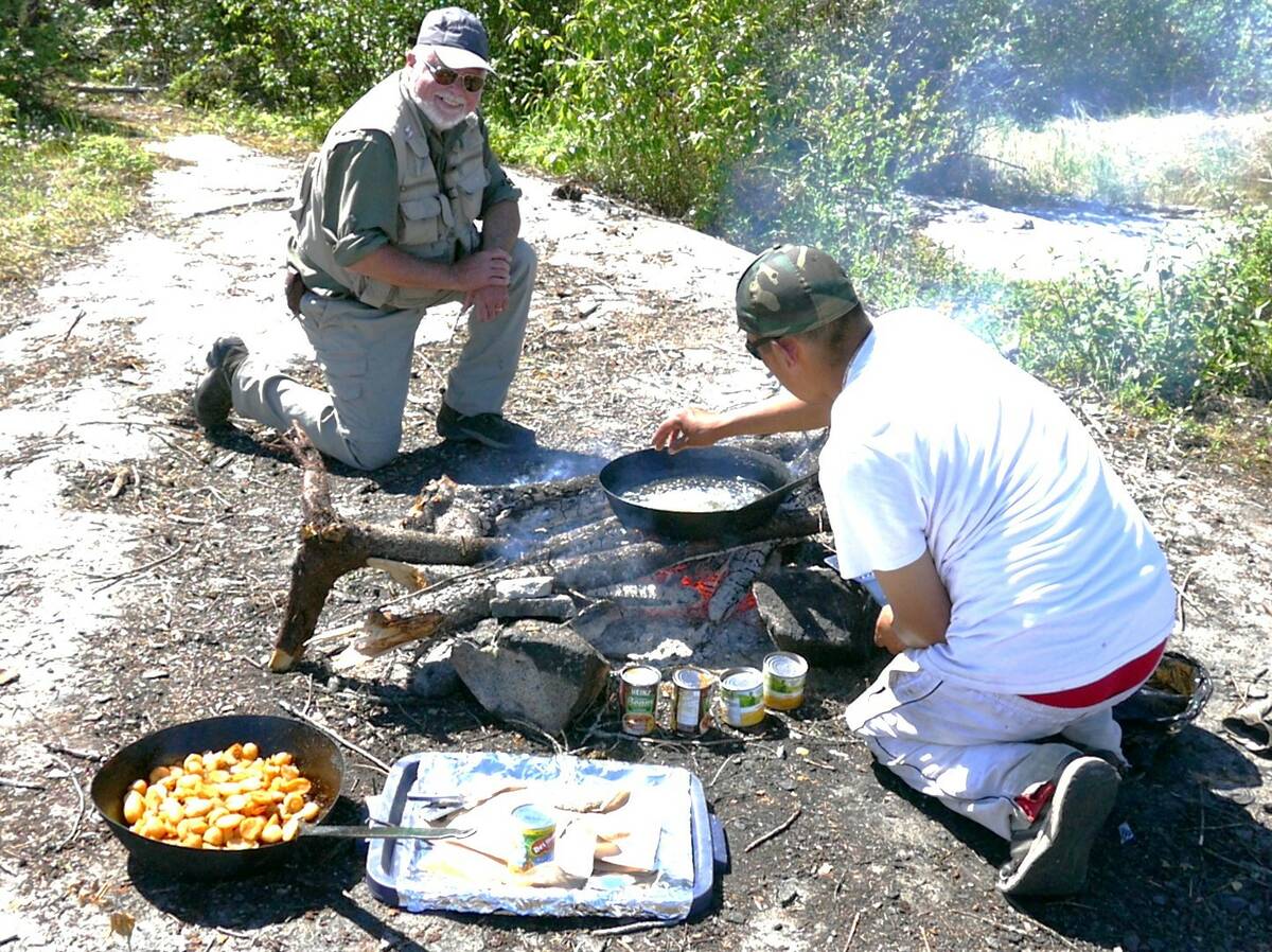A classic shore lunch of deep fried fish, potatoes, canned beans and corn helps to make fishing trips all the more memorable. Photo: Tim Sopuck