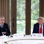 FILE PHOTO: U.S. President Donald Trump and Canadian Prime Minister Mark Carney attend a meeting with G7 leaders and guests, at the G7 summit in Kananaskis, Alberta, Canada,  June 16, 2025.  REUTERS/Kevin Lamarque/File Photo
