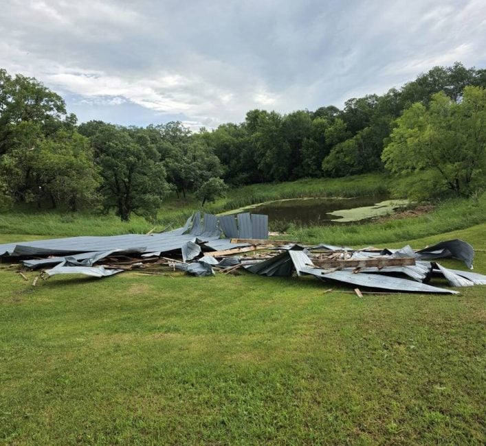 The storm ripped the roof off a pole barn and deposited it about 100 feet away. Photo: Kevin Funk