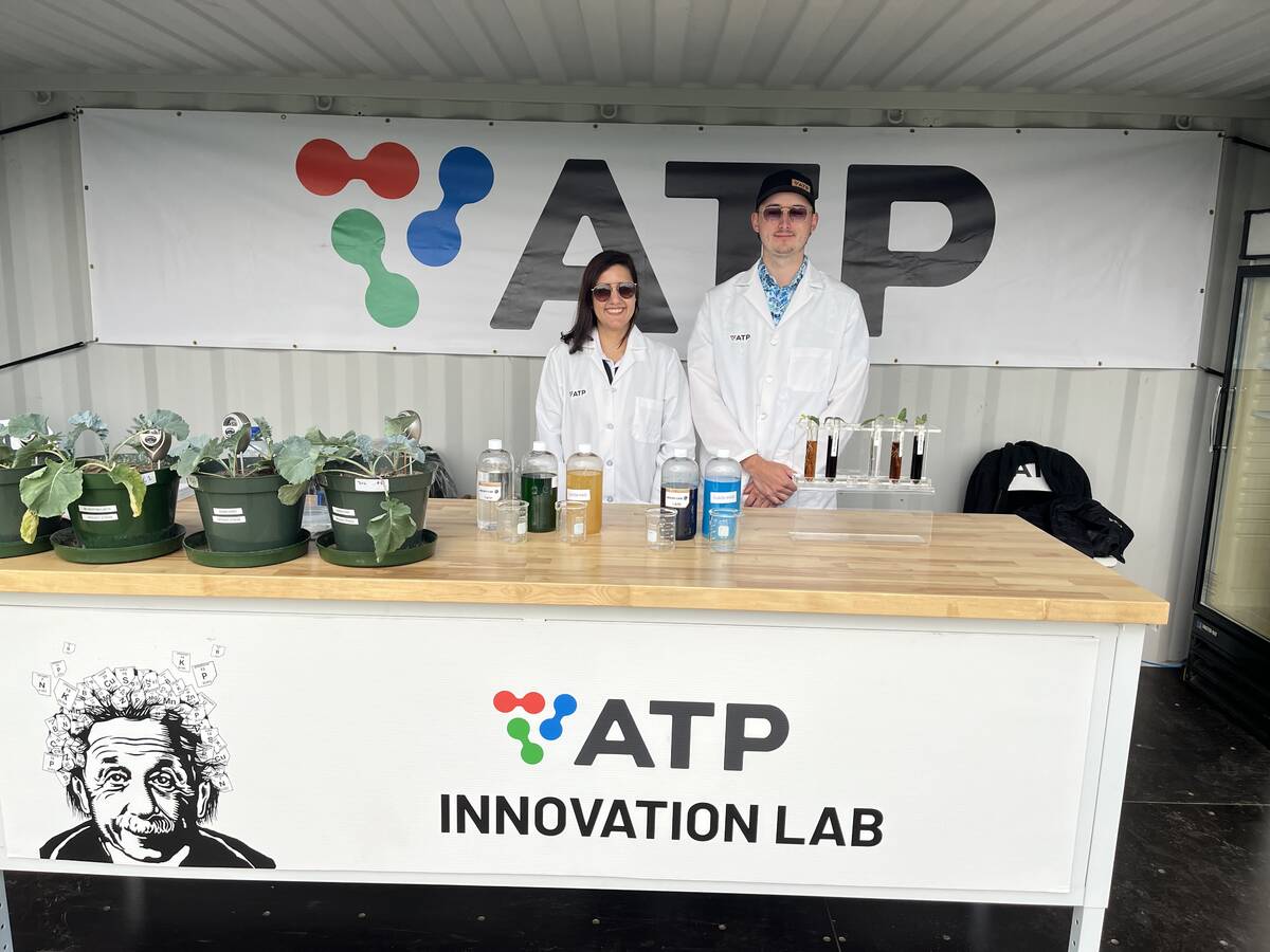 Barbara Hodecker, director of research and development for ATP Nutrition, and Aron Kathler, regional account manager for western Manitoba and South Eastern Saskatchewan, are all smiles after ATP won the 2025 Ag in Motion Innovation in Agriculture Award for 2025. Photo: Greg Price