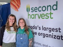 Emily Owen (left) and Katherine Hepp (right) at Second Harvest’s booth at Agriculture in Motion on July 16, 2025. Photo: Geralyn Wichers