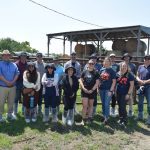 Researchers, Manitoba Canola Growers Association staff and farmer Jackie Dudgeon-MacDonald (front row, second from right) at the Dudgeon-MacDonald farm during a two-day canola camp June 24.