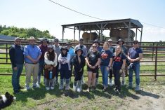 Researchers, Manitoba Canola Growers Association staff and farmer Jackie Dudgeon-MacDonald (front row, second from right) at the Dudgeon-MacDonald farm during a two-day canola camp June 24.