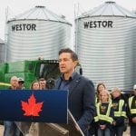 Conservative leader Pierre Poilievre addresses electric vehicles and China’s recent tariffs against Canadian canola seed at a press event on a Saskatchewan grain farm Aug. 14, 2025. Photo: Janelle Rudolph
