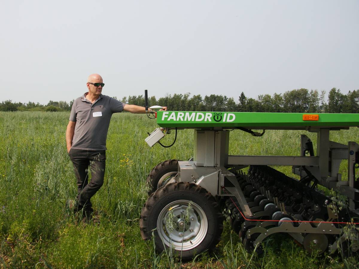 Stefan Graner with his FarmDroid seeder and weeder at his farm near Paddockwood, Sask. Photo: Janelle Rudolph