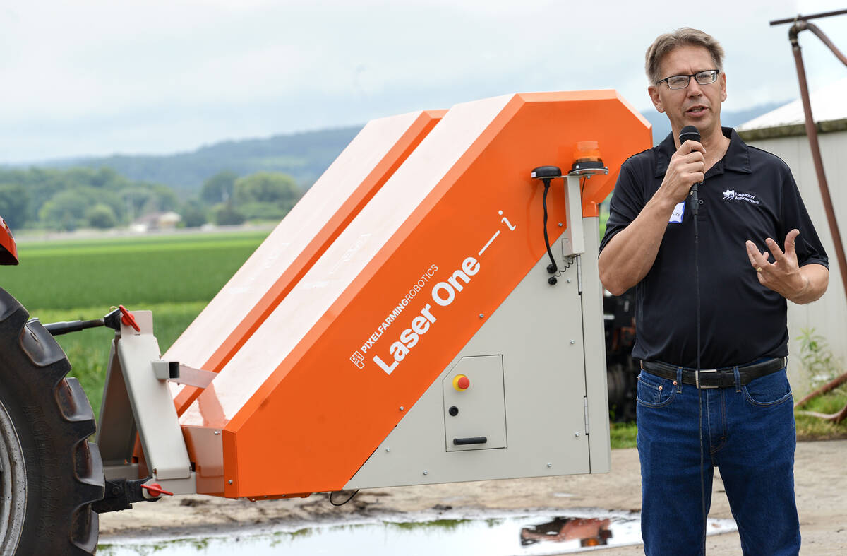 Chuck Baresich, Haggerty AgRobotics, explains how the Pixelfarming Laser One–i prototype was adapted to fit the Orio NAiO’s frame during the Ontario Crops Research Centre in Bradford on July 9, 2025.