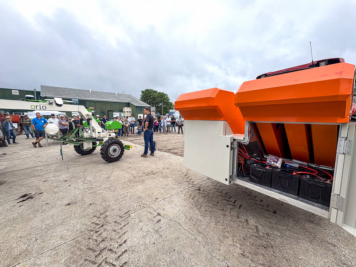 Chuck Baresich, Haggerty AgRobotics, explains how the Pixelfarming Laser One–i prototype was adapted to fit the Orio NAiO’s frame during the Ontario Crops Research Centre in Bradford on July 9, 2025. Photo: Diana Martin