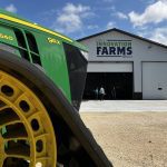The nose of a John Deere tractor on the grounds at EMILI Innovation Farms near Grosse Isle, Manitoba, on August 6, 2025.  Photo: Greg Berg (note: select vertical option included if it works better for print)