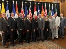 From left: New Brunswick agriculture minister Pat Finnigan, PEI minister Bloyce Thompson, Alberta minister RJ Sigurdson, Ontario minister Trevor Jones, Manitoba minister Ron Kostyshyn, federal minister Heath MacDonald, BC minister Lana Popham, Sask. minister Daryl Harrison, Nova Scotia Greg Morrow and John Streicker from Yukon. Photo: Karen Briere